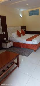 Meru Slopes Hotel客房内的一张或多张床位