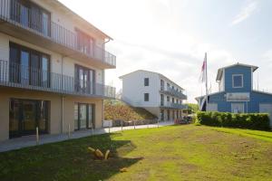 a view of the front of the building at Ferienwohnungen im Hafen Pier1 am Cospudener See bei Leipzig in Markkleeberg +44 photos