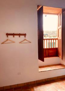 a room with a window with a view of the ocean at Casa Santo Domingo Guadalupe Santander in Guadalupe