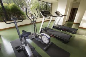 a gym with three exercise bikes in a room at Hotel Eurosol Leiria & Jardim in Leiria
