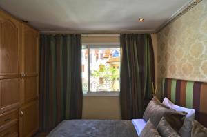 Postel nebo postele na pokoji v ubytování Résidence Ifrane Palace