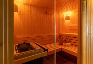 a sauna with a tub and a sink at Hotel Kammweg in Grossbreitenbach +18 photos