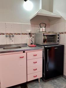 Kuchyň nebo kuchyňský kout v ubytování Apart Hotel Nonquen