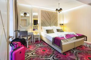 Łóżko lub łóżka w pokoju w obiekcie Hotel Royal Baltic 4* Luxury Boutique