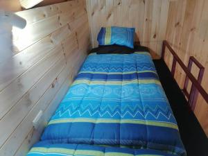 Ein Bett oder Betten in einem Zimmer der Unterkunft Acogedora cabaña para descansar en Caburgua