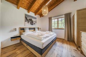 Postel nebo postele na pokoji v ubytování Dachstein West Apartment T4