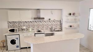 Kuchyňa alebo kuchynka v ubytovaní Driopon Apartment - Penthouse