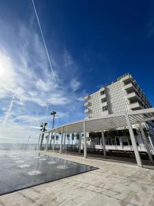a large building with a fountain in front of it at FAY Victoria Beach in Rincón de la Victoria