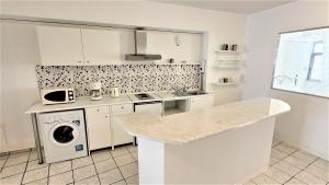 Kuchyňa alebo kuchynka v ubytovaní Driopon Apartment - Penthouse