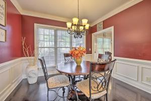 a dining room with a table and chairs at Wendell Home with Fenced Yard, Close to Raleigh in Knightdale