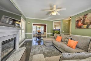 a living room with a couch and a fireplace at Wendell Home with Fenced Yard, Close to Raleigh in Knightdale