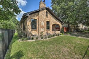 a brick house with a chimney on top of a yard at Eclectic Houston Home Less Than 4 Mi to Downtown! in Houston