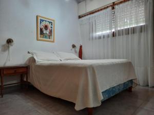 a bedroom with a bed and a window at Super Apart in Miramar