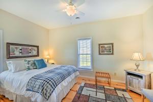 a bedroom with a bed and a ceiling fan at Breathtaking Elkin Getaway with Vineyard Views! in Elkin