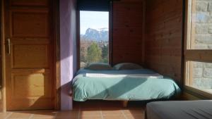 Ένα ή περισσότερα κρεβάτια σε δωμάτιο στο La Cicuarala