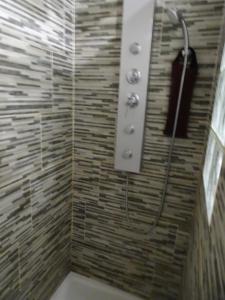 a shower with a shower head in a bathroom at Las Delicias ROSES in Roses +17 photos