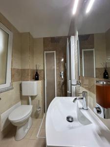 A bathroom at AGAS Exclusive Apartment