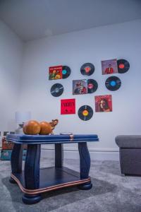 a table in a room with records on the wall at BV Classic 3 Bedrooms At Cliff Oak Leeds Perfect For Contractors in Leeds