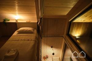 a small room with a small bed in a small room at Nad Poziomem in Radomice