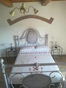 A bed or beds in a room at Agriturismo Il Bel Vedere