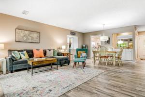 a living room with a couch and a table at Lucky Enough in Fernandina Beach