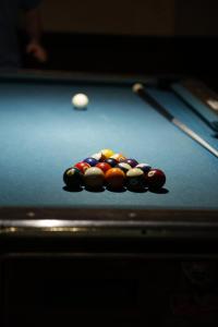a group of cue balls on a pool table at Jimmy OConnor's Windham Mtn Inn in Windham