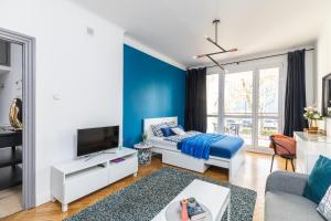 Posteľ alebo postele v izbe v ubytovaní SuperApart Lewartowskiego 10
