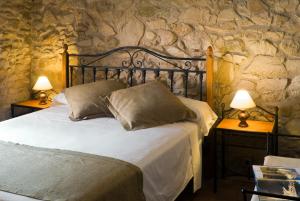 Cama o camas de una habitación en Casa Rural El Pati de l´Albera