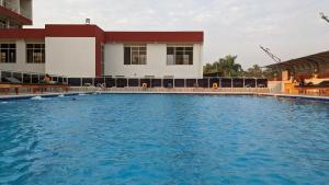 a large swimming pool in front of a building at KING'S CONFERENCE CENTRE in Bujumbura