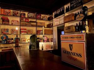 a bar in a restaurant with a sign on the counter at TW O Connell old world Irish pub in Cahersiveen