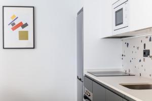 Kuchyň nebo kuchyňský kout v ubytování Apartamentos Congreso, Parking gratuito