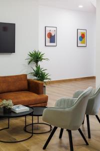 TV a/nebo společenská místnost v ubytování Apartamentos Congreso, Parking gratuito