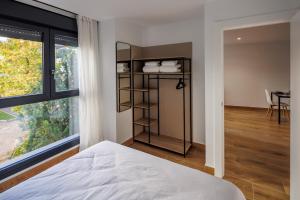 Postel nebo postele na pokoji v ubytování Apartamentos Congreso, Parking gratuito