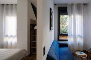 Postel nebo postele na pokoji v ubytování Apartamentos Congreso, Parking gratuito