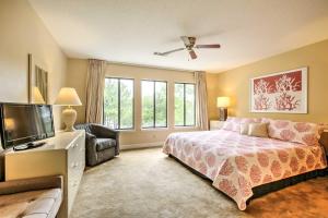 a bedroom with a bed and a flat screen tv at Niceville Condo with Pool Access Less Than 8 Mi to Destin! in Niceville