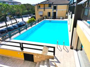 a large swimming pool on the balcony of a building at TRA CIELO E LAGO - Gerale H&B (CIR017067-CIM-00420) in Desenzano del Garda