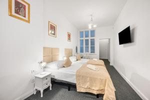 Postel nebo postele na pokoji v ubytování Downtown Bratislava B&B