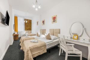 Postel nebo postele na pokoji v ubytování Downtown Bratislava B&B