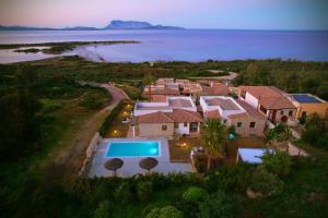 an aerial view of a house with a swimming pool at Villa Isuledda Lux in San Teodoro