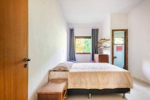 Postel nebo postele na pokoji v ubytování Sítio da Tia Lucia Perto da Montanha + 45 fotografií