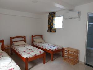 Postel nebo postele na pokoji v ubytování Casarão Nazaré Hostel