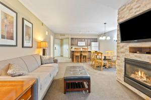 a living room with a couch and a fireplace at Horseshoe Hideaway Sleeps 8 in Oro-Medonte