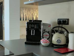 a coffee maker on a counter in a kitchen at TRA CIELO E LAGO - Gerale H&B (CIR017067-CIM-00420) in Desenzano del Garda