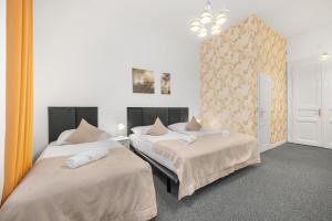 Postel nebo postele na pokoji v ubytování Downtown Bratislava B&B