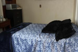 Säng eller sängar i ett rum på Habitacion 2 acceso independiente y autonomo Puebla