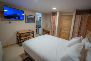 Postel nebo postele na pokoji v ubytování Calafate Apart Hotel