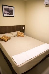 a bedroom with a large bed in a room at Downtown Santana Hotel in Rio de Janeiro