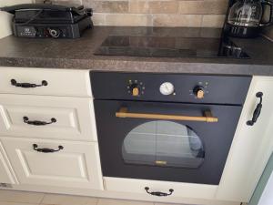 A kitchen or kitchenette at Cozy Corfiot house