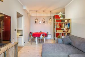 a living room with a table and a couch at Cosy apartment in the center of Chamonix - Welkeys in Chamonix-Mont-Blanc