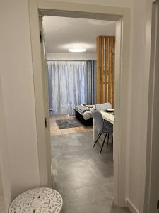 a room with a table and a dining room at Studio apartman Implex in Đakovo